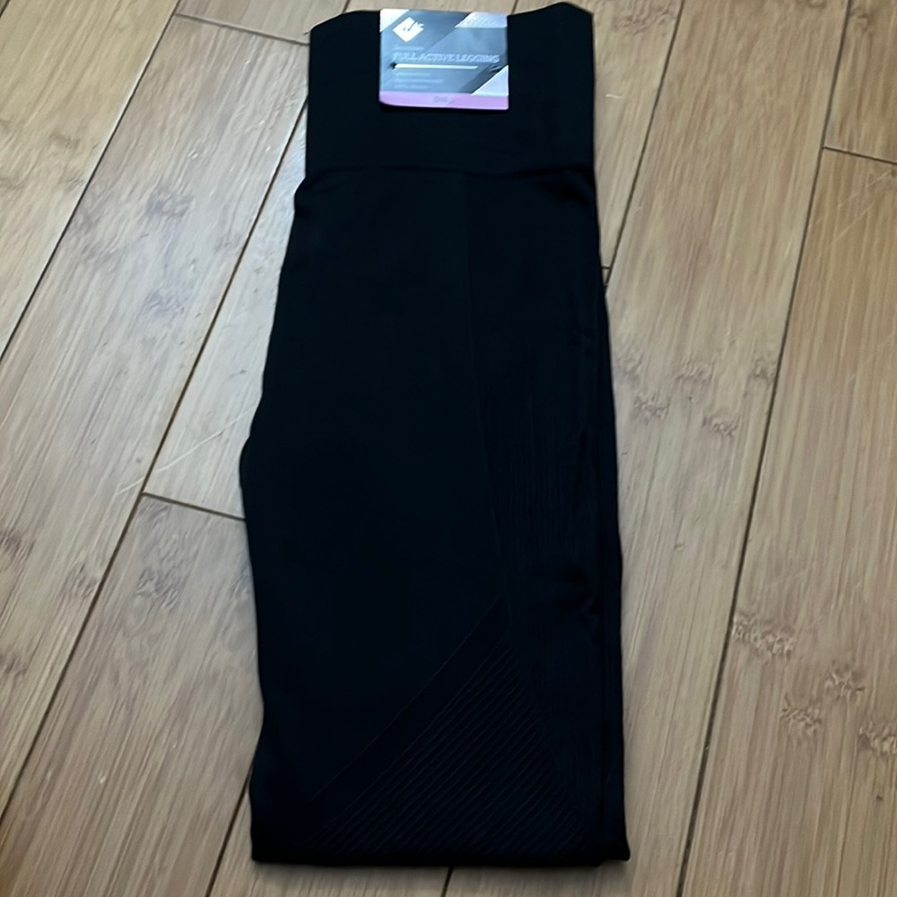 Brand new with tags. Black leggings with some design. Size small